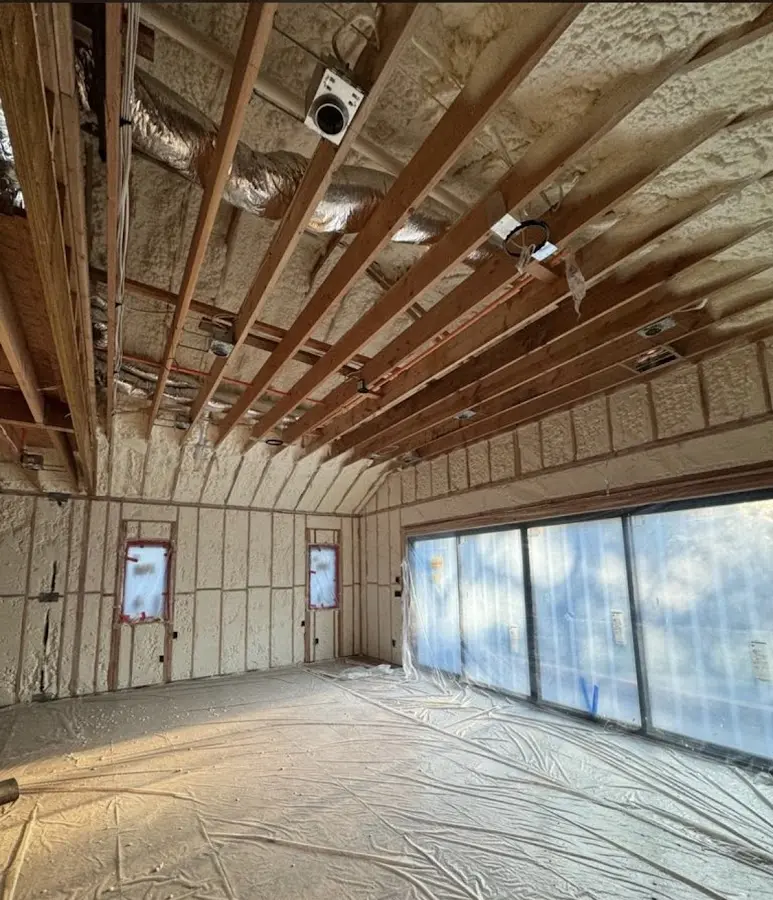 Interior walls and ceiling insulated with spray foam during new construction in Omaha